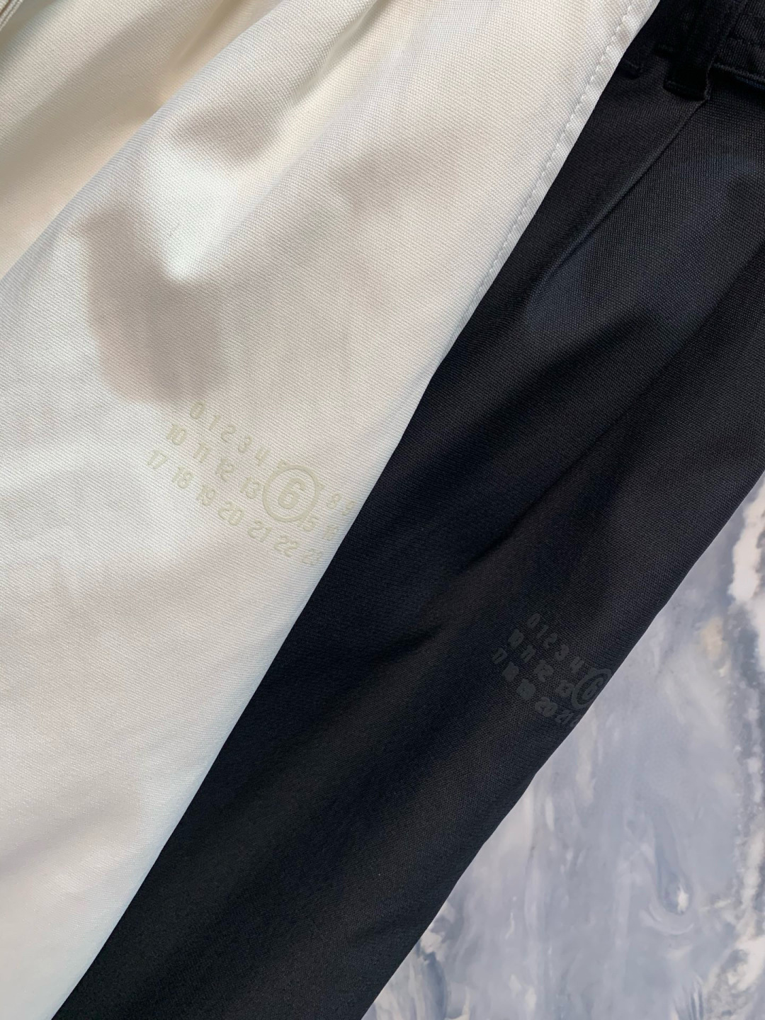 介绍一下这一款OU柜台限定发售男士户外运动防风防雨抽绳运动机能长裤的细节，标题，文案，要求介绍的特别高级