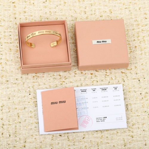 Miu Miu Gold-Tone Logo Cuff Bracelet, Stylish and Elegant Accessory 1 Miu Miu Gold-Tone Logo Cuff Bracelet, Stylish and Elegant Accessory