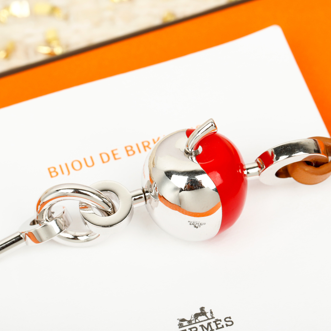 Hermes Bijou de Birkin N 1 bracelet Silver-toned metal with orange leather accents red enamel detail silver charms 17cm