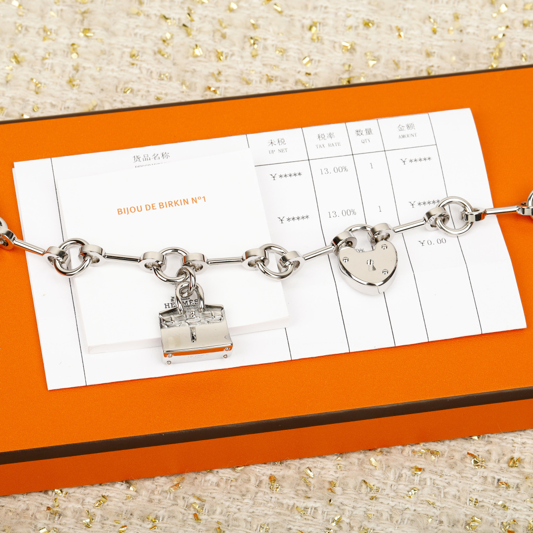 Hermes Bijou de Birkin N 1 bracelet Silver-toned metal with orange leather accents red enamel detail silver charms 17cm