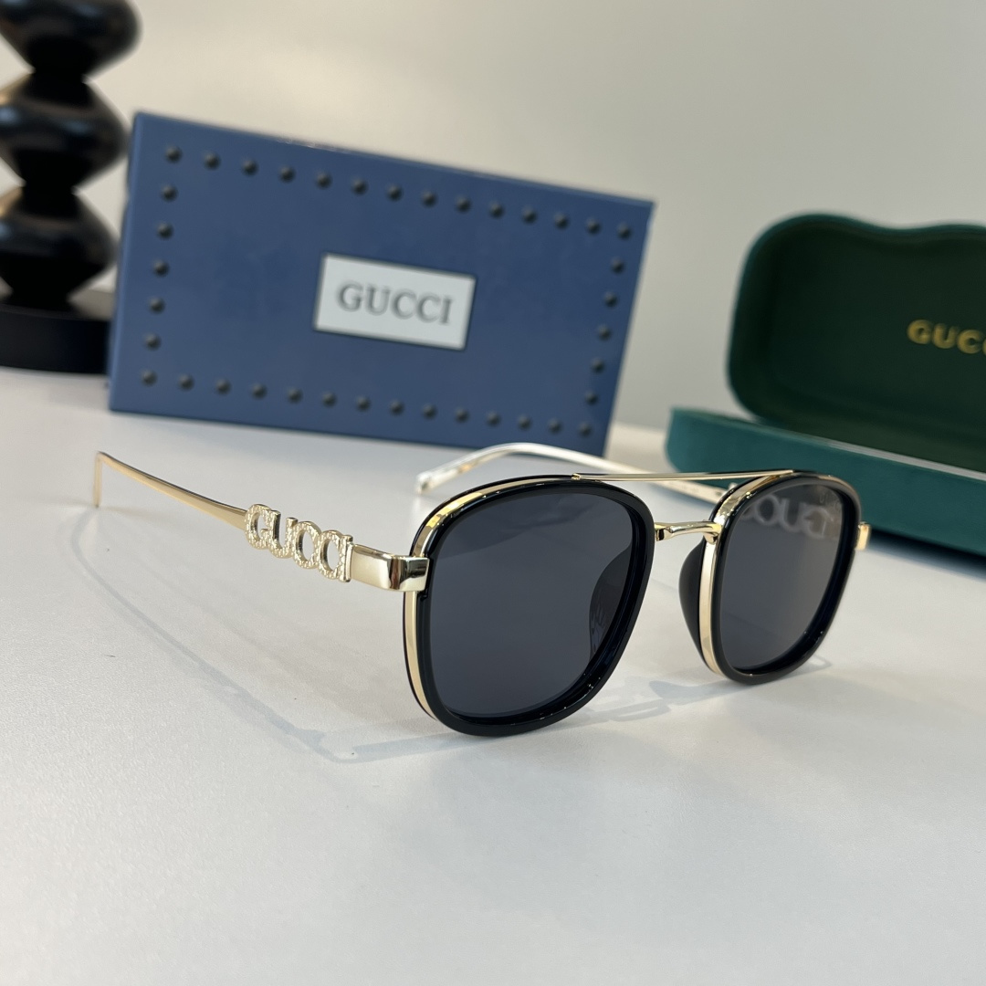 Солнцезащитные очки с золотистыми дужками Gucci