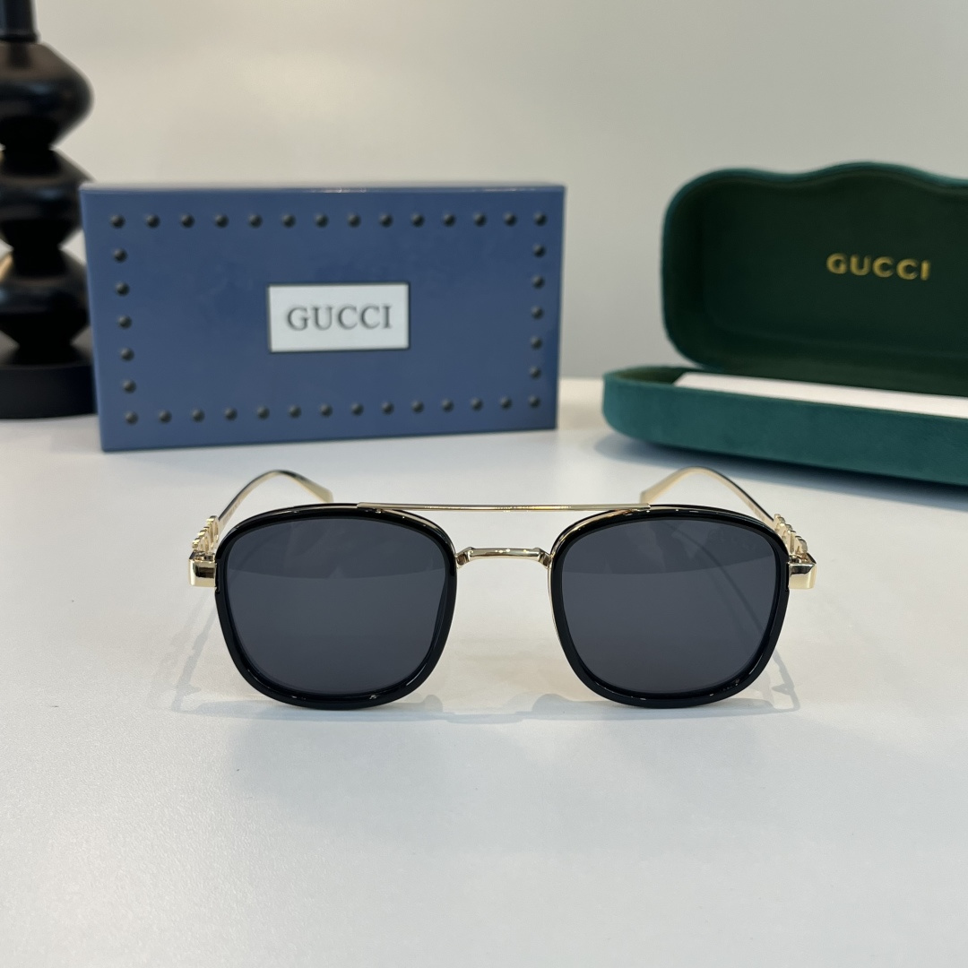 Солнцезащитные очки с золотистыми дужками Gucci