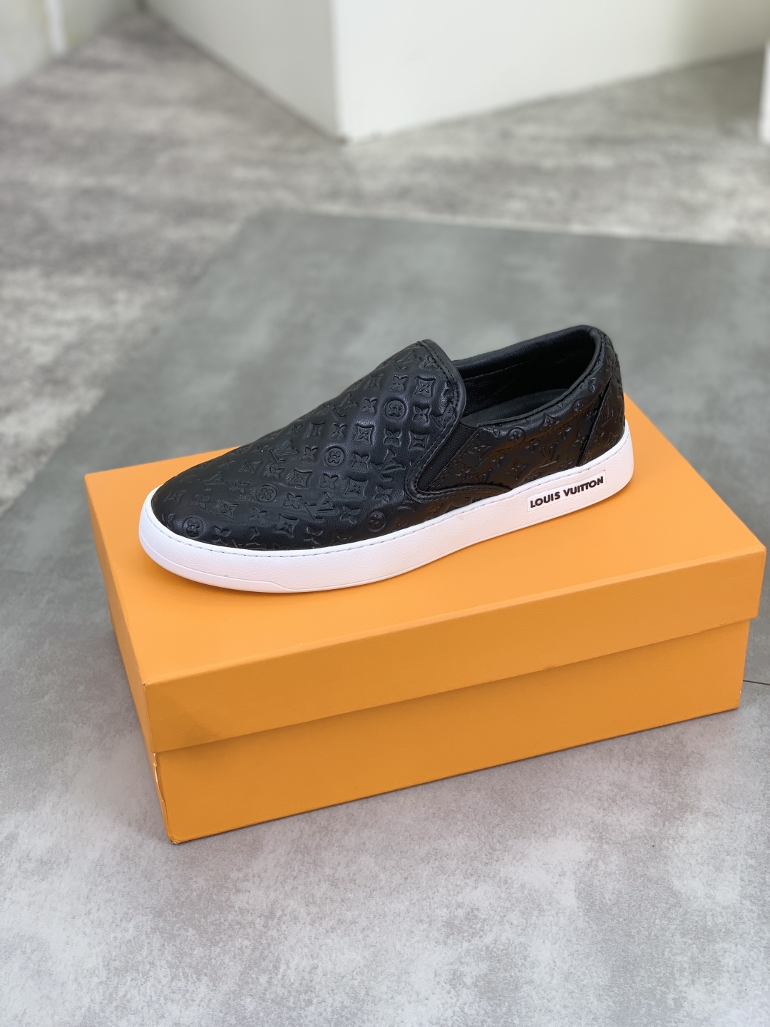 Louis Vuitton Men's Black Leather Monogram Embossed Slip-On Sneakers 19 cmp i1743269194101 695 0 3