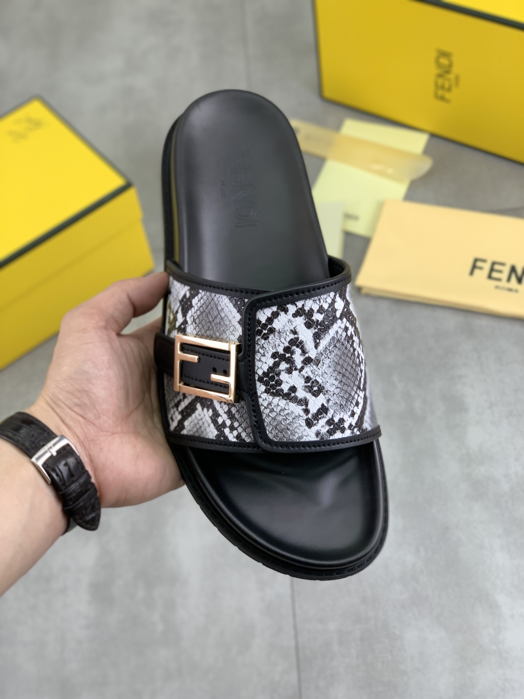 Fendi Men's Black Slide Sandal with Snake Print Strap and Gold Buckle 1 Fendi Men's Black Slide Sandal with Snake Print Strap and Gold Buckle