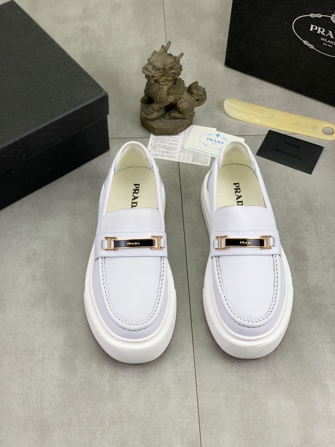 Prada Men's Classic White Leather Loafers with Signature Buckle Detail 3 cmp i1745598662912 6765 0 1