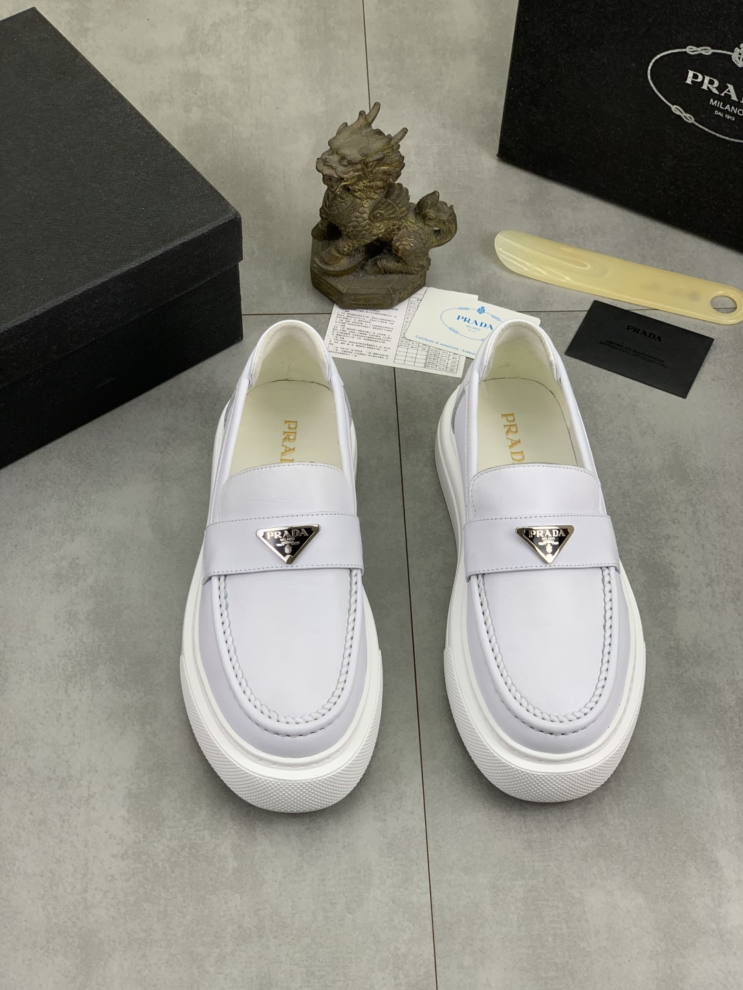 Prada Men's White Leather Loafers with Iconic Logo and Comfortable Fit 3 cmp i1745598774795 9780 0 1