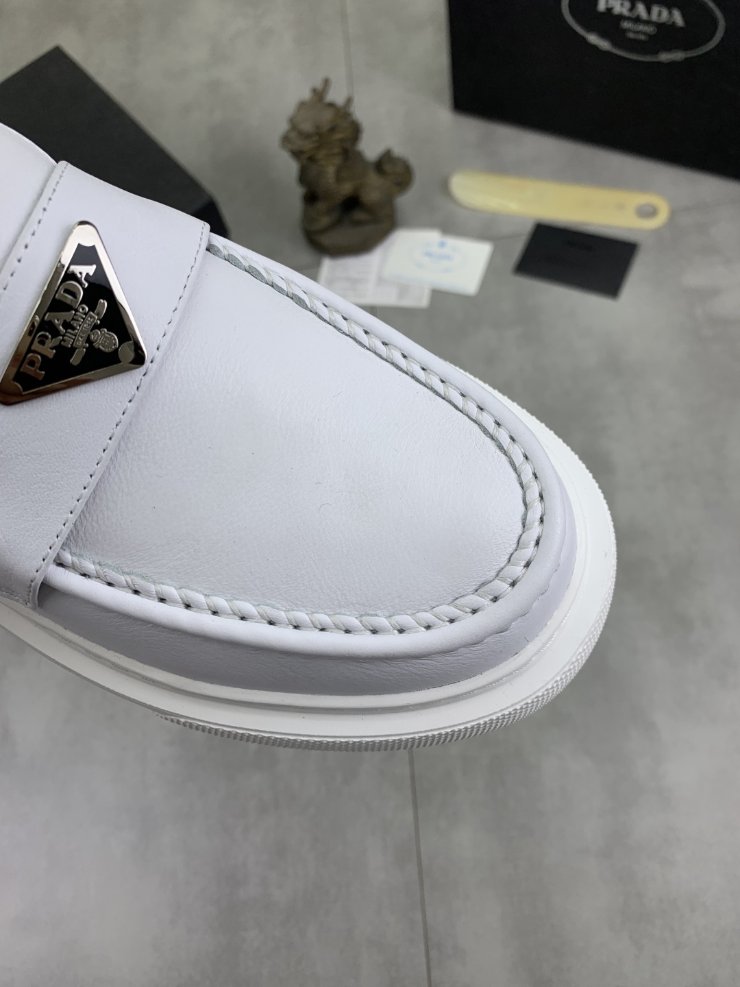 Prada Men's White Leather Loafers with Iconic Logo and Comfortable Fit 6 cmp i1745598775875 561 0 4