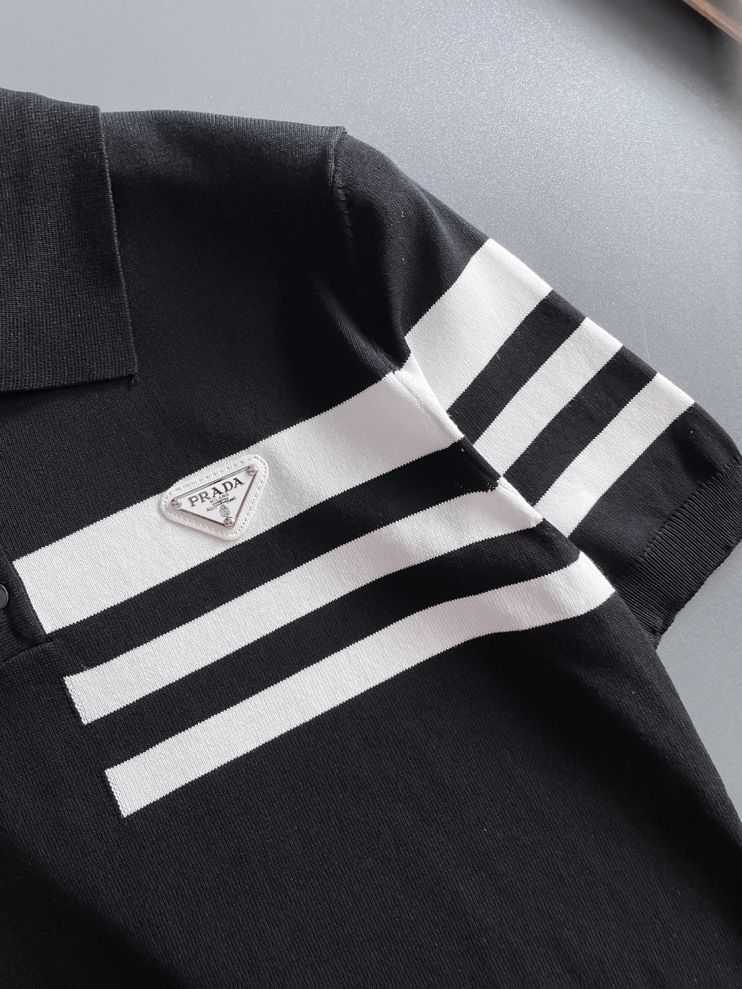 Prada Men's Black Polo Shirt With White Striped Accents - Spring 2025 7 cmp i1748623089824 4370 0 5