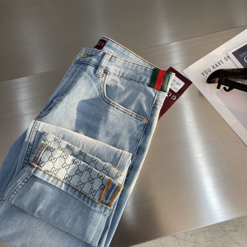 Gucci Men's Light Wash Denim Jeans with Signature Web and GG Motif 1 Gucci Men's Light Wash Denim Jeans with Signature Web and GG Motif