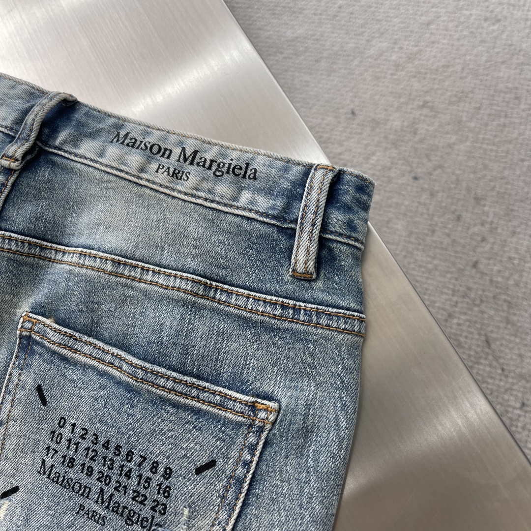 Maison Margiela Men's Distressed Denim Jeans with Numeric Label 8 cmp i1743429954610 6534 0 5