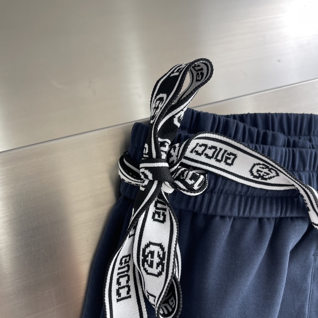 Gucci Men's Navy Blue Jogger Pants with White Logo and Side Stripes 3 cmp i1743495799766 6500 0 1