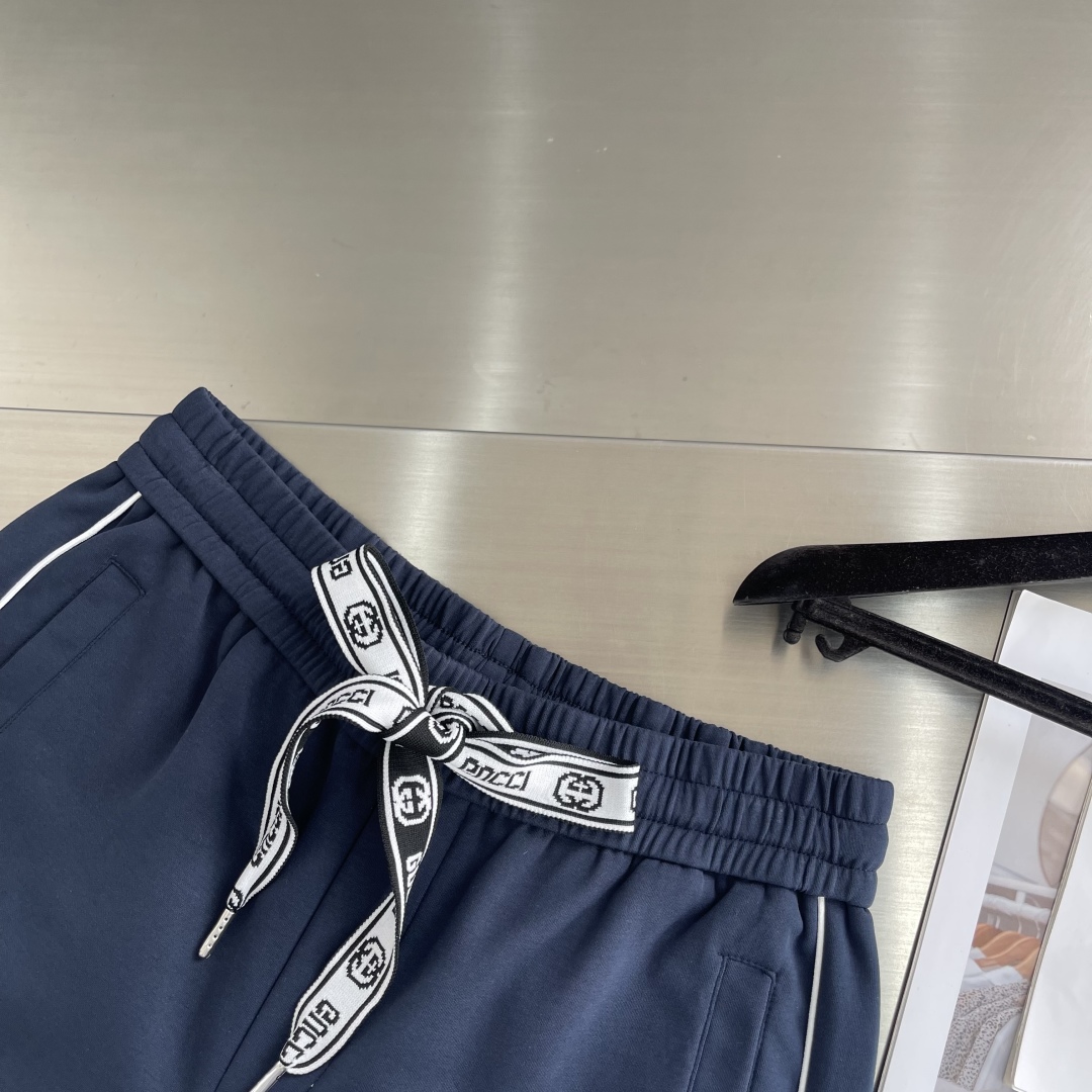 Gucci Men's Navy Blue Jogger Pants with White Logo and Side Stripes 6 cmp i1743495799770 2963 0 3