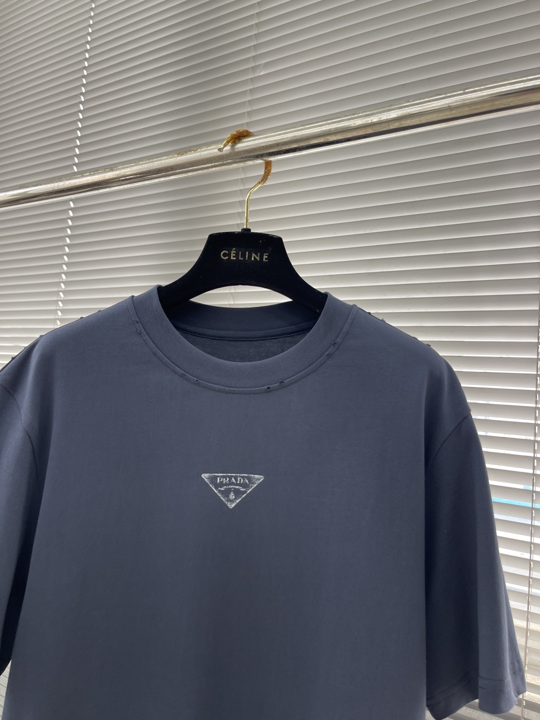 Prada Early Spring 2025 Vintage Hand-Painted Cotton Tee with Distressed Edges 2 cmp i1746699395394 0 0 7