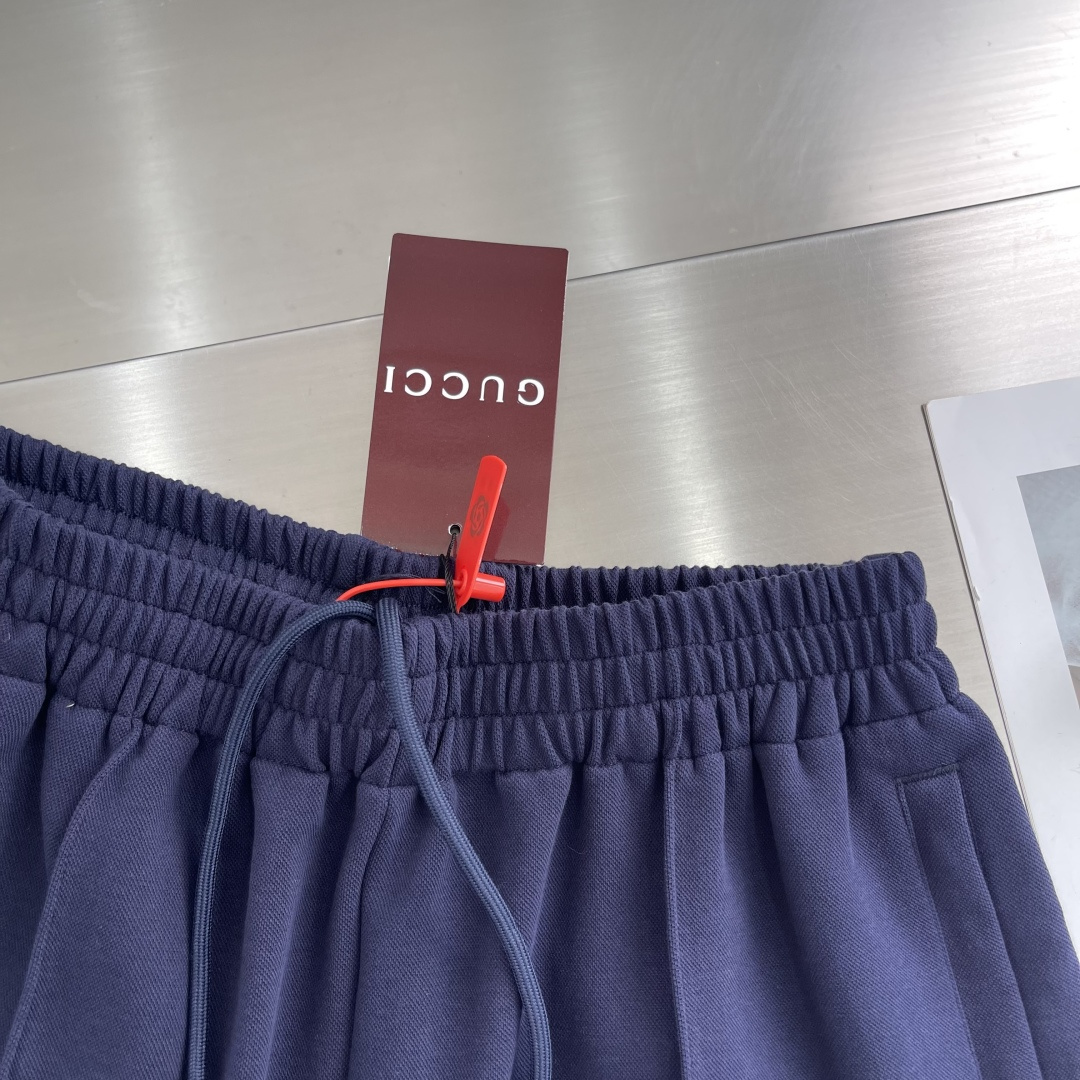 Gucc Transcript Pants: Luxurious Navy Blue Design with Custom Steel Stamp Detail - 图片 5