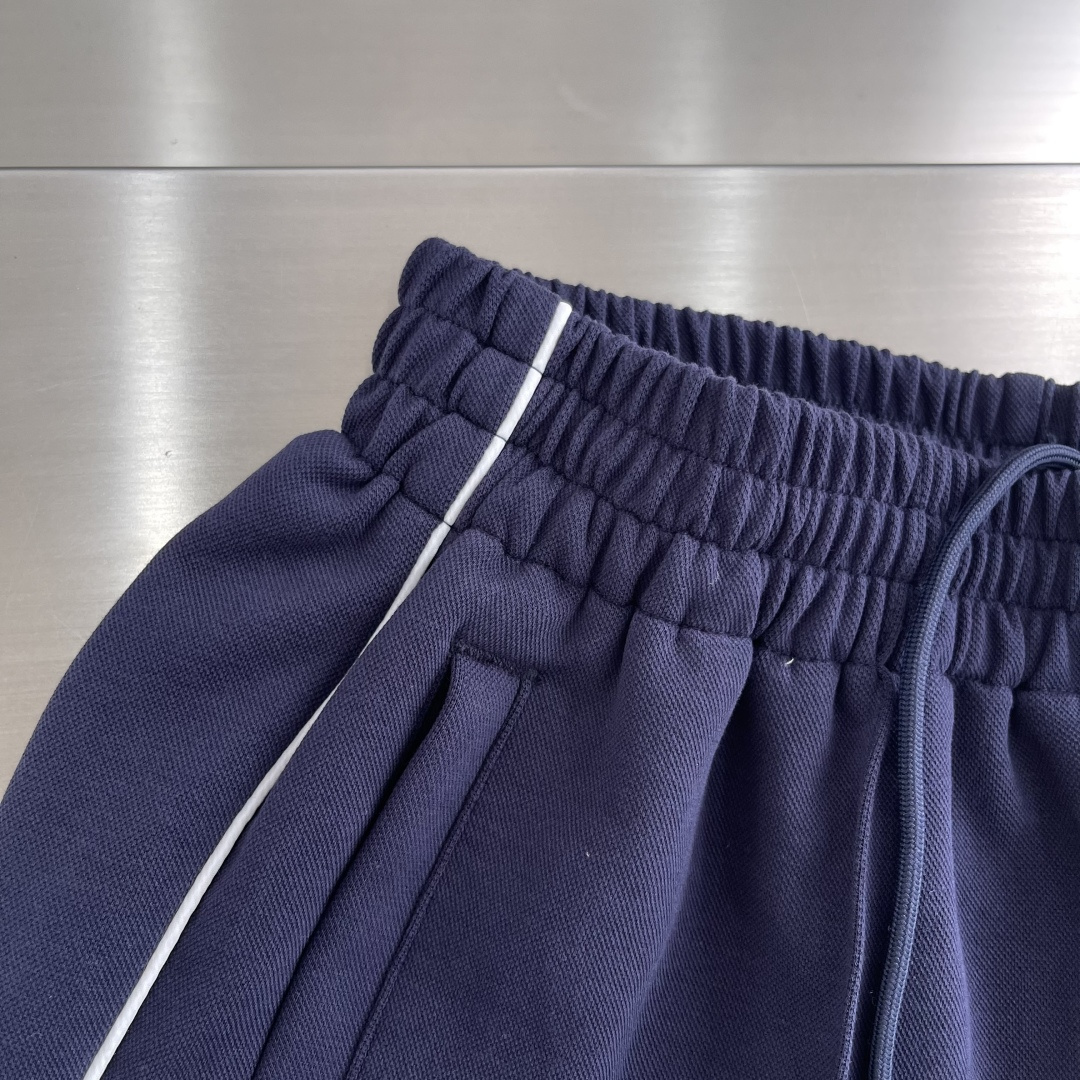 Gucc Transcript Pants: Luxurious Navy Blue Design with Custom Steel Stamp Detail - 图片 4