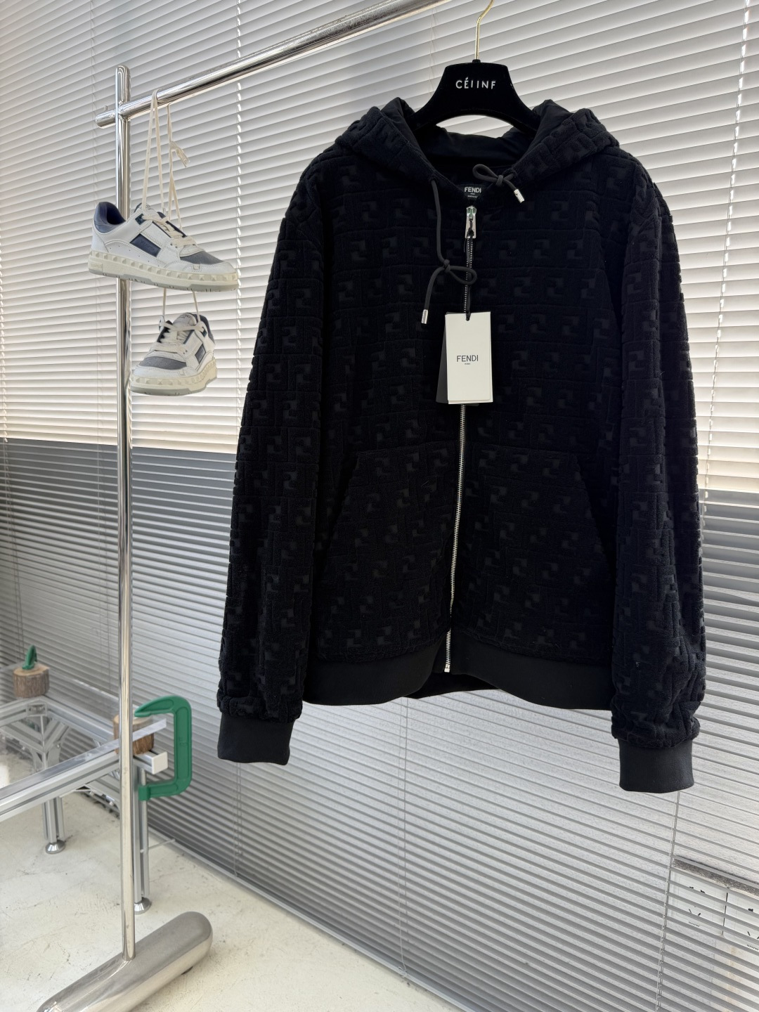 NO:743420,The highest version on the market, the girl inspects the goods, trims the three marks on the threads, and delivers the goods. You can send pictures and videos. If you want quality and service, please add me on WeChat. We will not accept urgent orders. -FEND all-print sweatshirt, cotton material. This sweatshirt is made of cotton FF terry cloth material, which is soft, comfortable and breathable. It is very suitable for sports or daily casual wear. Raised embossed effect. The black FF terry cloth material has a slight embossed embossed effect, which increases the layering and visual effects of the material, making the sweatshirt look more fashionable and stylish.  The long-sleeved design with a drawstring hood not only increases practicality, but also provides extra warmth and protection when needed, and also adds a casual and dynamic feel to the overall look. Ribbed cuffs and hem. The ribbed design ensures a tight fit between the cuffs and hem, effectively preventing wind from entering, while also improving the comfort and durability of wearing. The zipper opening and closing method makes it easier to put on and take off, and also adds a sense of fashion to the sweatshirt.  The silver-finished metal parts on the sweatshirt not only enhance the overall texture, but also highlight the sophistication and luxury of the Fendi brand. Size: S-XL Size Length Bust Shoulder Width S 6811649 M 69 120 50 L 70124 51 XL 71128 52, Fendi-clothing, fendi, fendi, hats,19860909市面最高版本小妹验货、修剪线头上三标、发货可发图及拍视频,要品质要服务的加我微信,不接急单. -FEND满印运动衫 棉材质.这款运动衫采用棉的FF毛巾布材质,柔软舒适,透气性好,非常适合运动或日常休闲穿着. 凸纹压花效果.黑色FF毛巾布材质上略带凸纹压花效果,增加了材质的层次感和视觉效果,使得运动衫看起来更加时尚有型. 长袖设计搭配抽绳兜帽,不仅增加了实用性,还能在需要时提供额外的保暖和防护,同时也为整体造型增添了一份休闲与动感. 罗纹袖口和下摆.罗纹设计确保了袖口和下摆的紧密贴合,有效防止风进入,同时也提升了穿着的舒适度和耐用性. 拉链开合方式使得穿脱更加便捷,同时也为运动衫增添了一份时尚感. 运动衫上的银色饰面金属件不仅提升了整体的质感,还彰显了芬迪品牌的精致与奢华. 码数: S-XL  尺码衣长胸围肩宽 S 6811649 M 69 120 50 L 70124 51 XL 71128 52,芬迪-服装,fendi,fendi,hats,,Women's clothing