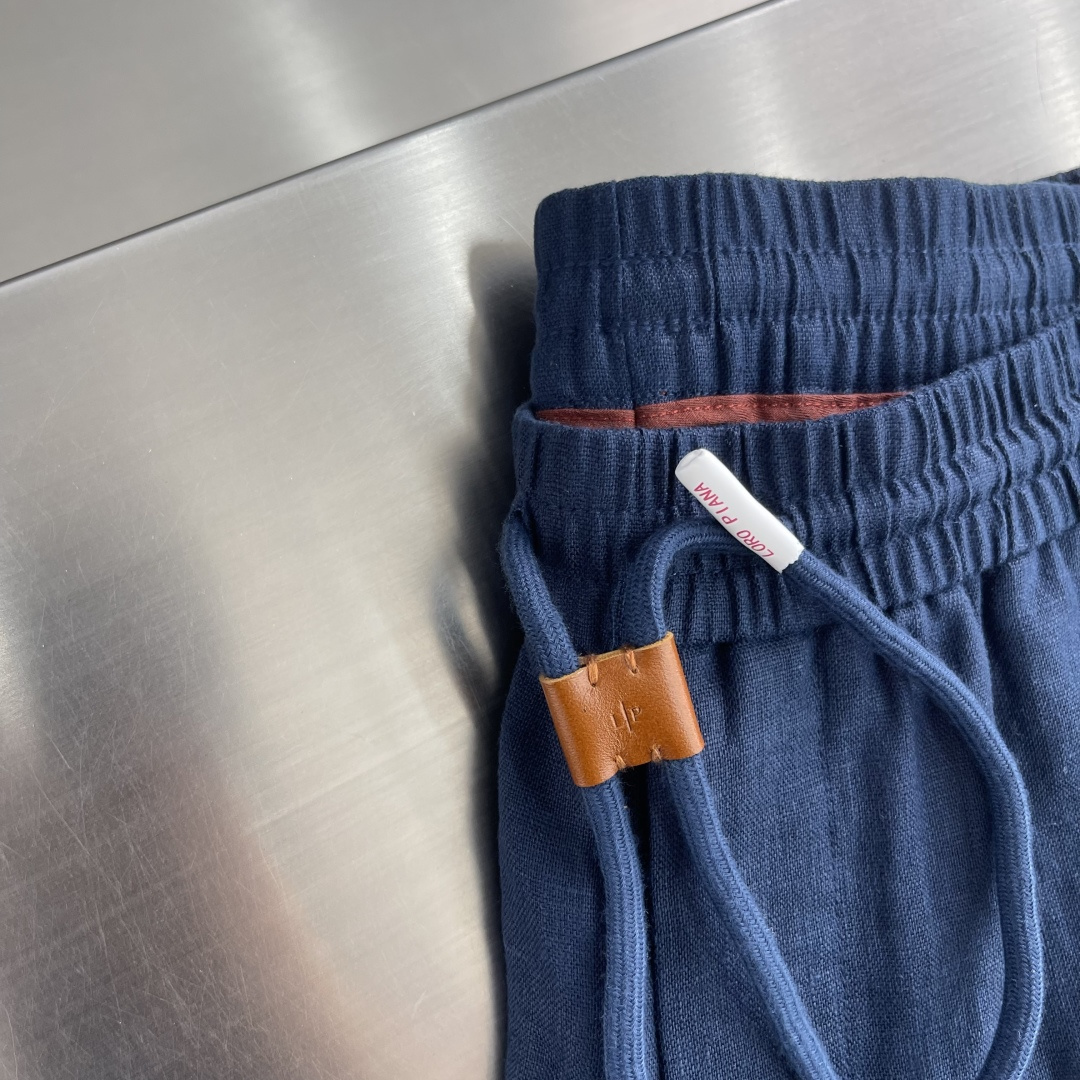 -Loro Piana    100%亚麻皮质扣抽绳休闲长裤一、核心材质与工艺  1. 面料：100%进
