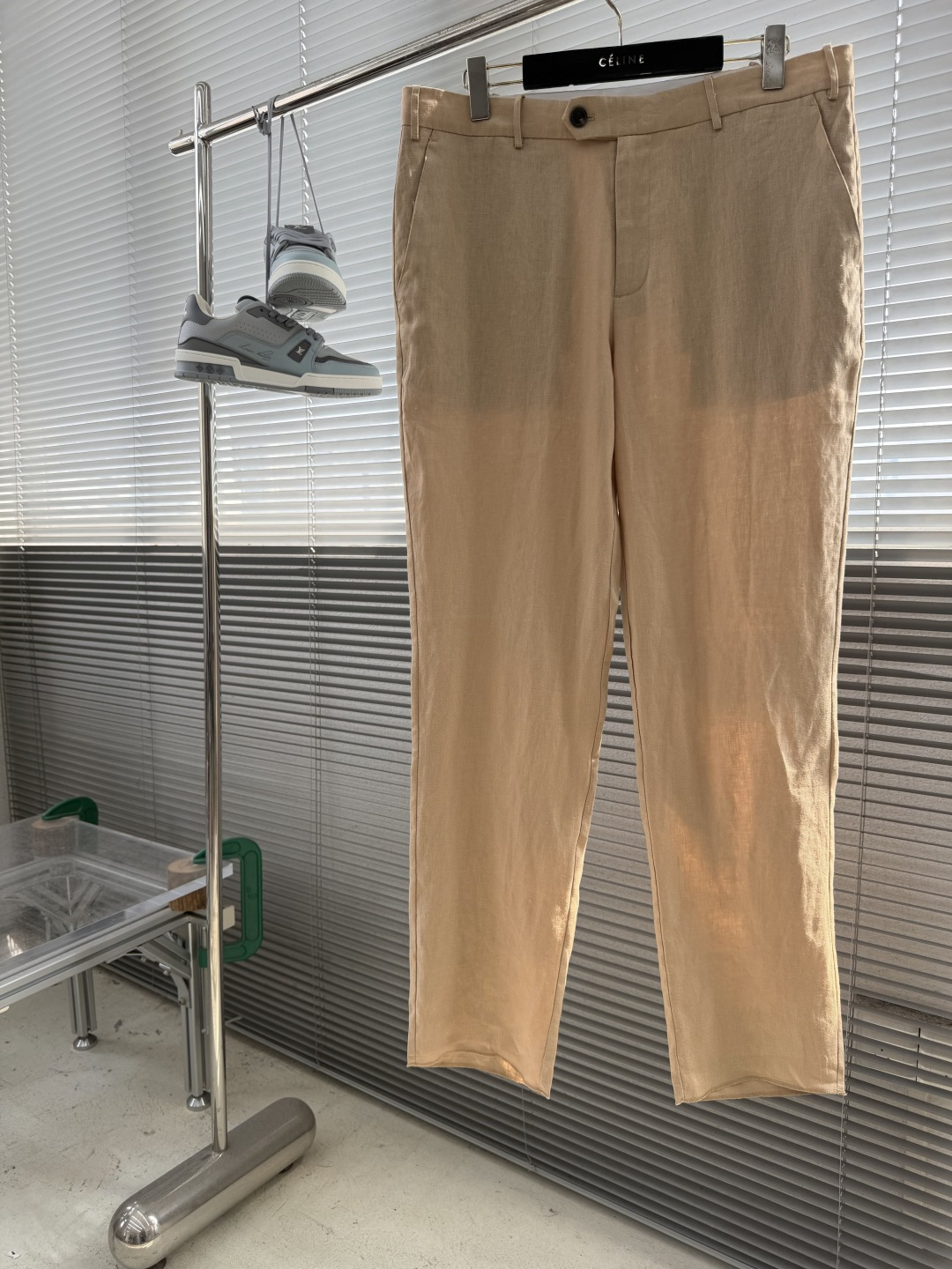 NO:957760,Trousers -Loro Piana men's linen casual trousers·naturally breathing Italian elegance. Fabric linen (raw material certified by Masters of Linen in Normandy, France). Slightly loose casual style (straight cut, adaptable to various body shapes). 1. The centuries-old craftsmanship heritage of natural luxury linen 1. Top-quality raw materials and sustainable concepts  Golden-producing linen selects long-fiber flax from the core production areas of Normandy, France and Belgium. It is grown under natural rainwater irrigation. The fiber is stronger and the texture is more delicate. It is certified by Masters of Linen and is made in Europe from planting to ready-made garments. It gives the fabric natural antibacterial, moisture-absorbing and breathable properties, and the body temperature is reduced by 3-5°C when worn in summer.  The innovative process breaks the stereotype of traditional linen as 'rough and easy to wrinkle'. It adopts the 'softening textile technology' of Solbiati's century-old factory to make the fabric feel as light as clouds while maintaining a crisp and drapey feeling, which is not easy to collapse after sitting for a long time. 2. Italian aesthetic design details The warm caramel brown color of retro ocher tones, combined with the original texture of natural linen, presents a low-key and layered 'old money style' texture, suitable for the atmosphere of spring and summer sunshine and autumn leaves. Structured tailoring  The waist is designed with a white contrasting waist lining, which can adjust the waist circumference by ±2cm, taking into account both comfort and neatness; pocket technology, front diagonal pockets with burgundy lining, double back patch pockets with matte black buttons, and stitching with cotton thread of the same color, highlighting the handcrafted warmth in the details; zippers and buttons are customized with 'L.P' logo metal zippers, which are smooth and silent, and the warm luster and linen texture form a material collision. 3. Washing and maintenance guide 1. Washing method  Hand washing is preferred. Use neutral laundry detergent (such as wool/silk detergent). The water temperature should not exceed 40°C. Press gently to remove stains to avoid rubbing and pulling to cause fiber deformation. Machine washing tips: If you need to put it in a laundry bag for machine washing, select 'gentle mode' and wash separately (linen easily absorbs dyes from other fabrics). Bleach and fluorescent whitening agents are prohibited. 2. Drying and shaping  Dry in the natural shade and lay flat in a ventilated place to dry, or hang on a wide-shouldered hanger (avoid the hanger from directly contacting the waist to prevent deformation). Avoid direct sunlight (to prevent the fabric from fading and the fibers from becoming brittle). Semi-dry shaping. When it is 80% dry, gently stretch the trouser legs and waist to restore the original shape and reduce wrinkles. 3. Ironing techniques  The maximum temperature of the soleplate of the temperature control iron is 110°C. It is recommended to iron at low temperature with a wet towel. Keep a distance of 3cm between the iron and the fabric and shape it with steam instead of pressing it directly. Wrinkle aesthetics The natural wrinkles of linen are its unique style. There is no need to pursue absolute smoothness, and the slight texture is more casual and advanced. 4. Long-term storage Clean and store, wash and dry, then fold and store to avoid hanging for too long and causing drape deformation; mothballs can be placed in the wardrobe (wrap them in breathable paper to avoid direct contact with the fabric).  Use a soft brush to gently sweep the dust on the surface before storing at the alternation of seasons, and put moisture-proof paper when folding to maintain a dry environment. ------ Note: Linen fabrics may have slight discoloration and shrinkage (approximately 3 times) during the first wash, which is normal. It is recommended to wash it separately for the first time. Subsequent wear will become softer and more comfortable with subsequent wear. Size 42/44/46/48/50/52/54/56 (30-3837), loro piana, gold,19860909长裤 -Loro Piana 男士亚麻休闲西裤·自然呼吸的意式雅绅风范  面料亚麻（法国诺曼底产区Masters of Linen认证原料）  版型微宽松休闲款（直筒剪裁,适配多元身形） 一、自然奢感亚麻的百年工艺传承 1.顶级原料与可持续理念  黄金产区亚麻甄选法国诺曼底与比利时核心产区的长纤维亚麻,经天然雨水灌溉生长,纤维韧性更强、肌理更细腻.通过Masters of Linen认证,从种植到成衣全程欧洲制造,赋予面料天然抗菌、吸湿透气的特性,夏季穿着体感温度降低3-5℃.  革新工艺打破传统亚麻“粗糙易皱”的刻板印象,采用Solbiati百年工厂的“柔化纺织技术”,使面料触感如云朵般轻盈,同时保持挺括垂坠感,久坐不易塌陷. 2.意式美学设计细节  复古赭石色调温暖的焦糖棕配色,融合自然亚麻的原生肌理,呈现低调而富有层次的“老钱风”质感,适配春夏阳光与秋季落叶的氛围感.  结构型剪裁 腰头设计白色撞色腰衬,可微放量调腰围±2cm,兼顾舒适与利落； 口袋工艺前片斜插袋配酒红色内里,后片双贴袋带哑光黑纽扣,缝线采用同色系棉线,细节处彰显手工温度； 拉链与纽扣定制“L.P”标识金属拉链,顺滑静音,温润光泽与亚麻肌理形成材质碰撞. 三、洗涤与保养指南 1.洗涤方式  手洗为优使用中性洗衣液（如羊毛/丝绸专用洗涤剂）,水温不超过40℃,轻柔按压去污,避免搓揉拉扯导致纤维变形.  机洗提示若机洗需放入洗衣袋,选择“轻柔模式”,单独洗涤（亚麻易吸附其他面料的染料）,禁用漂白剂及荧光增白剂. 2.晾晒与塑形  自然阴干平铺于通风处晾干,或用宽肩衣架悬挂（避免衣架直接接触腰头,防止变形）,禁止阳光直射（防止面料褪色、纤维变脆）.  半干塑形晾晒至8成干时,轻轻拉伸裤腿及腰头,恢复原始版型,减少褶皱产生. 3.熨烫技巧  温度控制熨斗底板最高温度110℃,建议垫湿毛巾低温熨烫,熨斗与面料保持3cm距离,通过蒸汽塑形而非直接按压.  褶皱美学亚麻的自然褶皱是其独特风格,无需追求绝对平整,轻微肌理更显随性高级. 4.长期存放  清洁收纳洗净晾干后折叠存放,避免悬挂过久导致垂坠变形；可在衣柜内放置樟脑丸（用透气纸包裹,避免直接接触面料）.  季节交替存放前用软毛刷轻扫表面灰尘,折叠时放入防潮纸,保持干燥环境. ------ 注亚麻面料初次洗涤可能出现轻微浮色与缩水（约3）,属正常现象,建议首次单独洗涤,后续穿着会越洗越柔软贴合. 码数42/44/46/48/50/52/54/56（30-3837）,,loro piana,gold,,Men's clothing