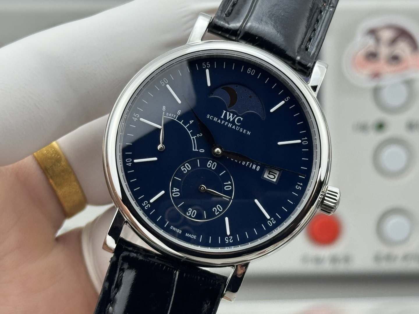 IWC Portofino Hand-Wound Moon Phase stainless steel case, black dial, black leather strap 45mm Men's Mechanical