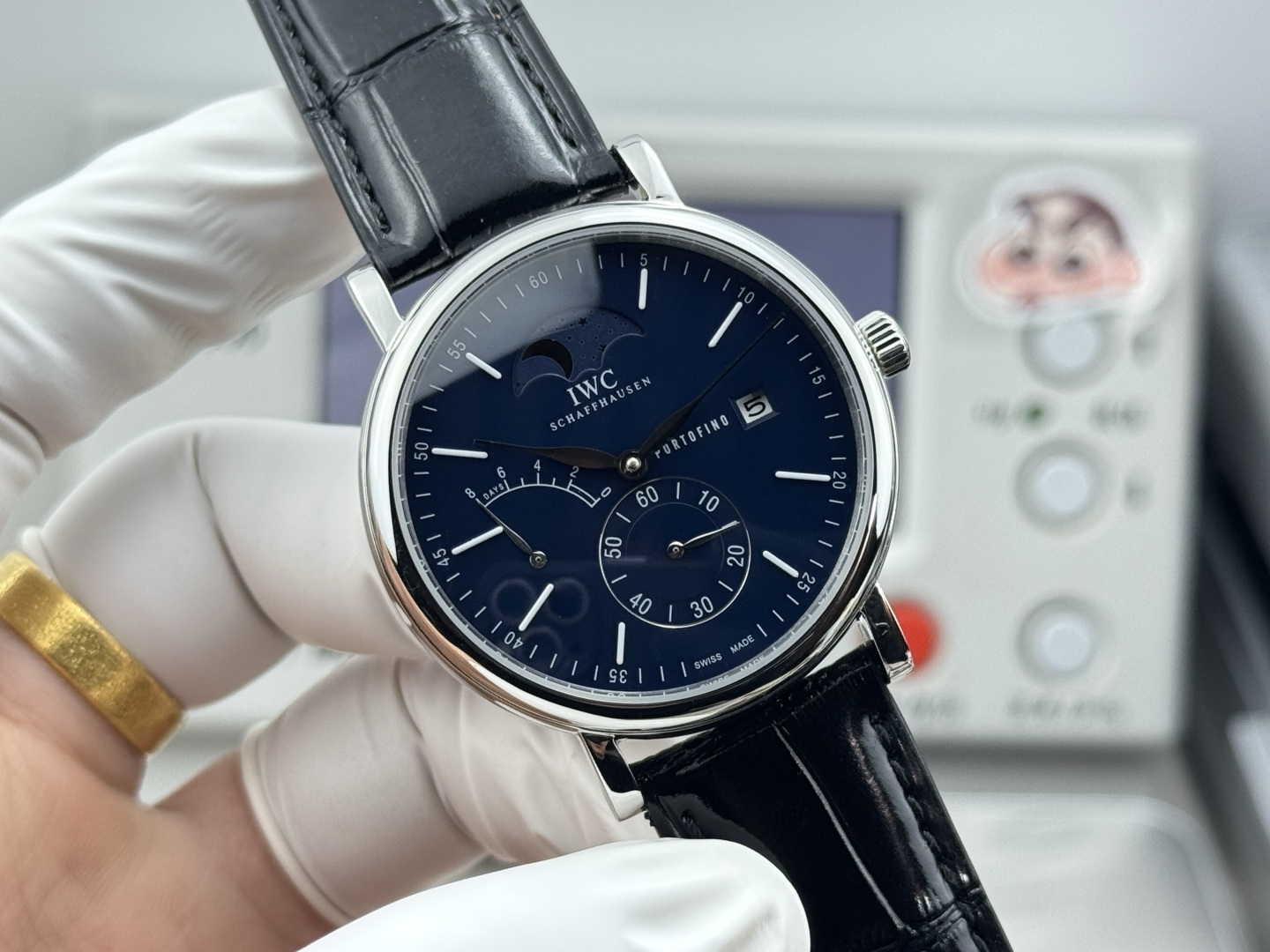 IWC Portofino Hand-Wound Moon Phase stainless steel case, black dial, black leather strap 45mm Men's Mechanical