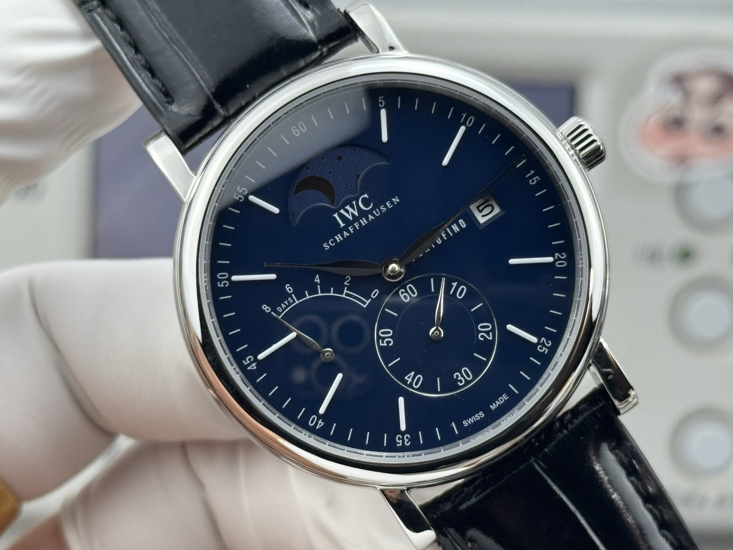 IWC Portofino Hand-Wound Moon Phase stainless steel case, black dial, black leather strap 45mm Men's Mechanical