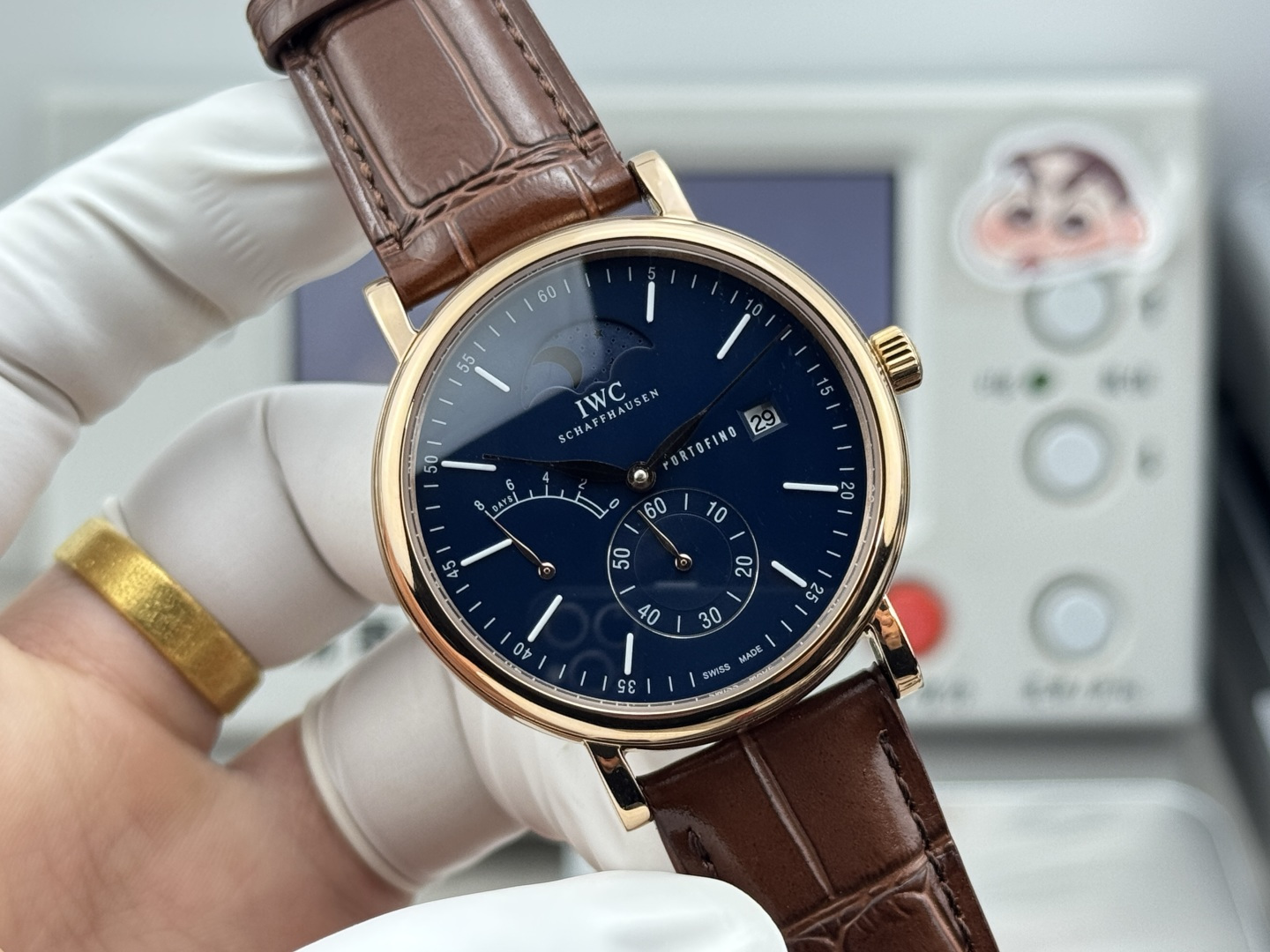 IWC Portofino Hand-Wound Moon Phase Eight Days rose gold case, blue dial, brown leather strap 45mm Men's Mechanical