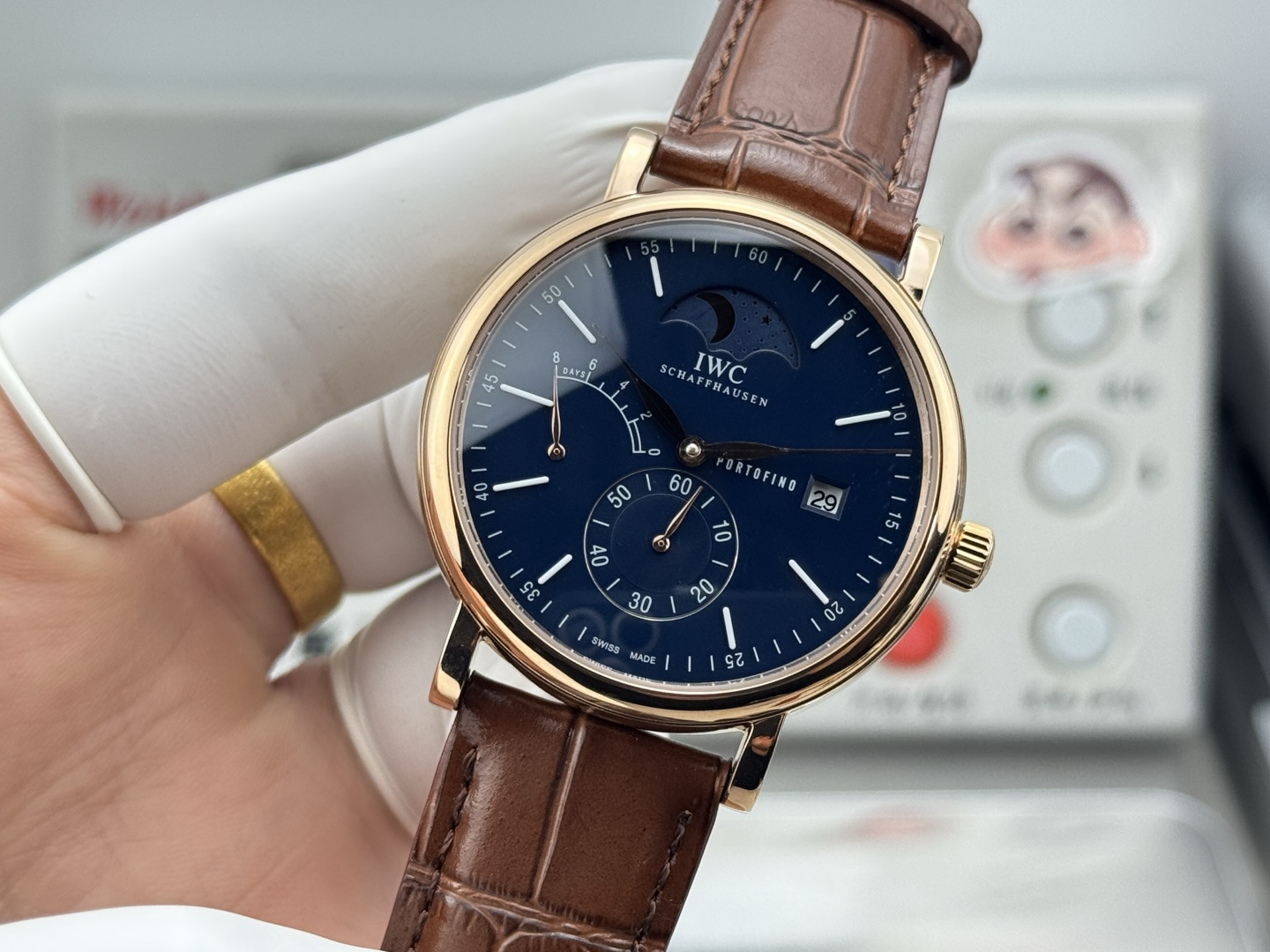 IWC Portofino Hand-Wound Moon Phase Eight Days rose gold case, blue dial, brown leather strap 45mm Men's Mechanical