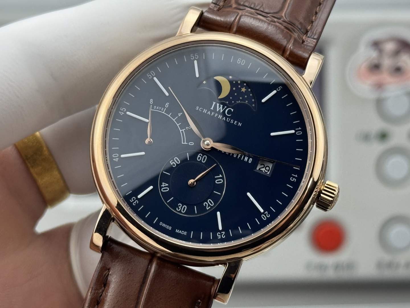 IWC Portofino Hand-Wound Moon Phase Eight Days rose gold case, blue dial, brown leather strap 45mm Men's Mechanical