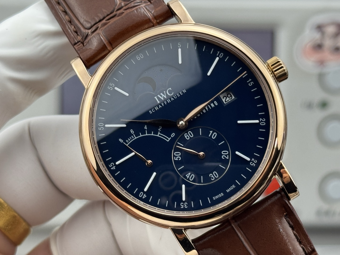IWC Portofino Hand-Wound Moon Phase Eight Days rose gold case, blue dial, brown leather strap 45mm Men's Mechanical