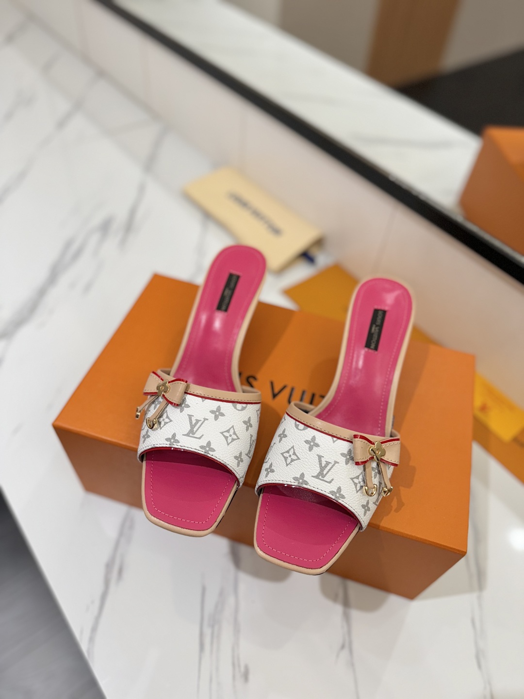Louis Vuitton Women's White Monogrammed Slides/Sandals with Pink Trim 4 cmp i1739785175682 1611 0 2