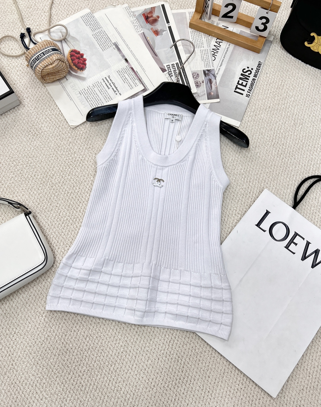 NO:312039,Chanel2025 new three-dimensional pattern knitted vest, customized YB cotton yarn woven, comfortable and soft, full of elasticity, U-neck knitted vest cut, neckline cuffs, same color threaded edges, ready-to-wear using advanced needlework, vertical pit strips and three-dimensional pattern decoration and edges, multi-layer horizontal patterns with the hem, adding literary atmosphere to the simple outfit, high-end tailoring fits the human body curve, simple decoration of the metal double C logo on the chest, can easily show the high street style, slim fit, slim and fashionable, all four seasons, single wear, custom surface accessories, three standards, two colors, size sml, chanel, alexander wang19860909Chanel2025新款立体花纹针织背心,定制YB全棉纱线织造 舒适软糯 弹力十足 U领针织背心裁剪 领口袖口同色系螺纹包边 成衣选用高级走针工艺 竖坑条和立体纹路装点与边缘 配合衣摆多层横向花纹 为简易穿搭增添文艺气息 高级剪裁贴合人体曲线 胸前金属双C徽标简单修饰 就能轻松彰显高街风格 修身版型 显瘦时髦 四季单穿叠穿都 定制面辅料三标齐全两色出 尺码sml,,chanel,alexander wang,Women's clothing