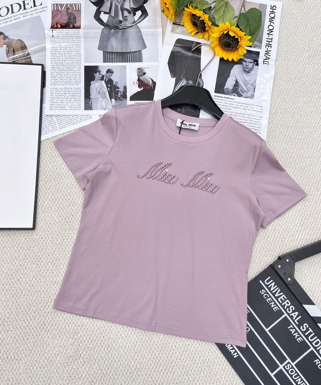 NO:318393,MIUMIU Beaded Letter Short-sleeved T-shirt, the classic letter design is matched with shining bead elements, which reveals a sense of luxury in simplicity, easily enhancing the fashion of the overall shape. Whether it is a daily street or a casual party, you can become the focus. The details of the beads add a sense of luxury and show a unique taste. The simple design is easy to match, and it can be easily controlled whether it is jeans or skirts. The beads are embellished in the sun, instantly enhancing the highlights of the overall shape. Wear the Miumiu Beaded Letter Short-sleeved T-shirt to easily create a summer look that coexists with fashion and elegance!  Two colors are outstanding!  Three-standard size sml, miumiu, skirts, jeans, T-shirt, tees, t-shirt, alexander wang19860909MIUMIU 钉珠字母短袖T恤,经典的字母设计搭配闪耀的钉珠元素,简约中透露着奢华感,轻松提升整体造型的时尚度.无论是日常出街还是休闲聚会,都能让你成为焦点. 钉珠细节增添高级感,彰显独特品味.简约设计易于搭配,无论是牛仔裤还是半身裙都能轻松驾驭. 钉珠点缀在阳光下熠熠生辉,瞬间提升整体造型的亮点. 穿上Miumiu钉珠字母短袖T恤,轻松打造时尚与优雅并存的夏日造型！两色出！三标齐全 尺码sml,,miumiu,skirts,jeans,T-shirt,tees，t-shirt,alexander wang,Women's clothing