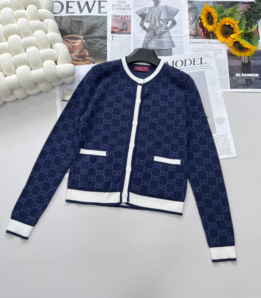 NO:687188,GUCCI Double G jacquard knitted cardigan is an important part of the ready-to-wear series. The knitted garment has a delicate touch and rich texture, helping you to enter the new season calmly without fear of seasonal changes. The same-tone rib piping is more sophisticated.  The iconic double G jacquard pattern is woven with exquisite craftsmanship, showing luxury in a low-key manner. Every glance is a manifestation of the brand's charm. The exquisite logo letter buckle is the finishing touch, and the details are full of style, which is a symbol of quality and status. Simple  The round neck design is versatile and elegant. Whether it is paired with a delicate skirt to attend a dinner or casual pants for a stroll on the street, it can be easily worn. It will exude charming style inadvertently and start a new chapter of your own fashion and elegance. Three standards are complete, and the goods are shipped in large quantities.  Size sml code,,gucci,skirts,19860909GUCCI 双G提花针织开衫,成衣系列的重要组成,针织服饰触感细腻且纹理丰富,助您无惧季节变迁,从容迈入新季.同色调罗纹滚边更显精致考究. 标志性双G提花图案,以精湛工艺织就,低调间流露奢华底蕴,每一眼皆是品牌魅力的彰显.精致logo字母扣,画龙点睛之笔,细节之处尽显格调,是品质与身份的象征.简约圆领设计,百搭且优雅,无论是搭配精致裙装出席晚宴,还是配搭休闲裤装漫步街头,都能轻松驾驭,于不经意间散发迷人风采,开启属于你的时尚奢雅新篇.三标齐全,大货出 尺码sml 编码,,gucci,skirts,,Women's clothing