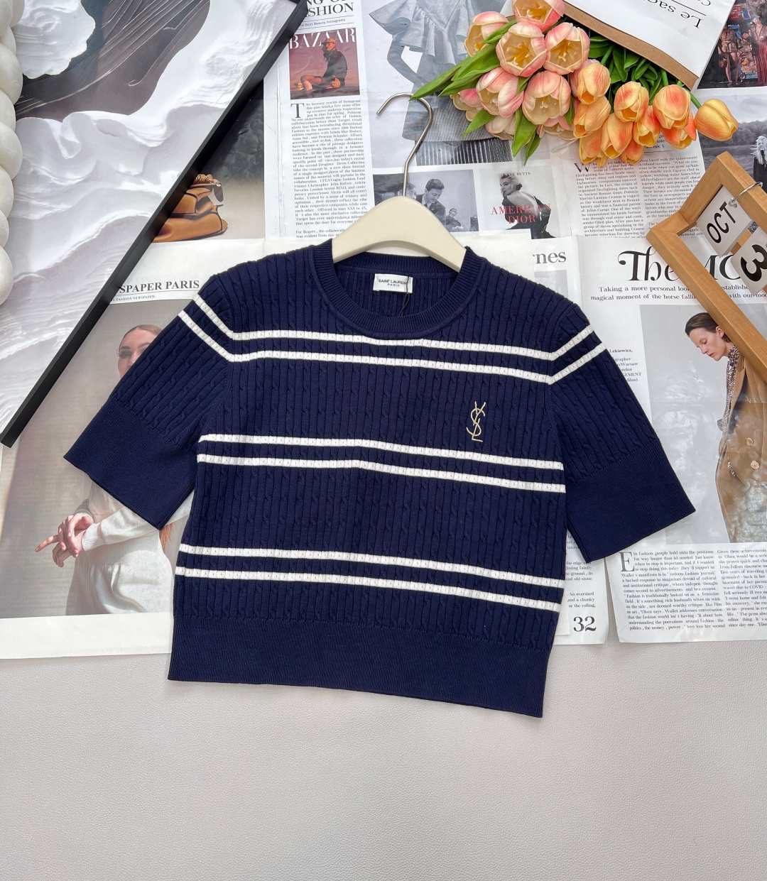 NO:500327,Saint Laurent YSL Golden letter embroidered striped knitted short sleeves. Classic striped elements created by navy blue + white, highlighting the relaxed and lazy fashion sense, three-dimensional collapsing texture, and relaxed texture and straightened!  The slim fit outlines the charming curves, and the ribbed elastic cuffs effectively cover the flesh of the arms. The short design creates a high-waist visual effect and shows the best proportion!  The shoulder line is just fixed at the edge of the shoulder, making the body look slimmer visually!  The chest is embroidered with gold-line letters, which complements the embossed metal buttons on the cuffs, making people shine. The upper body has no sense of oppression, and enjoys this lazy and freedom freely, and the fashionable tone is easy to grasp!  Complete three standards, large-scale products, size sml code, saint laurent, saint laurent, T-shirt, alexander wang19860909Saint Laurent YSL 金色字母刺绣条纹针织短袖 藏青色+白色打造的经典条纹元素,彰显轻松慵懒的时髦感,立体绞花肌理,轻松织构挺廓！ 修身版型勾勒迷人曲线,罗纹弹力袖口有效遮挡手臂的肉肉 短款设计打造高腰的视觉效果,展现最佳比例！肩线正好定在肩膀边缘,巧妙削薄身材视觉更显瘦！ 胸前采用金线字母刺绣设计,与袖口浮雕金属纽扣相得益彰,让人眼前一亮 上身穿着没有压迫感,肆意享受这份慵懒自由,时尚腔调也轻松拿捏！三标齐全,大货出 尺码sml 编码,,saint laurent,saint laurent,T-shirt,alexander wang,Women's clothing