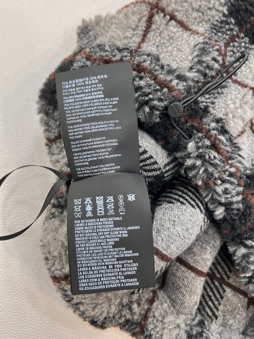 🆕Miumiu2025新款对格对条泰迪毛绒半裙，通体饰以泰迪羊毛绒材质，质感柔软舒适，时髦洋气，松紧腰短