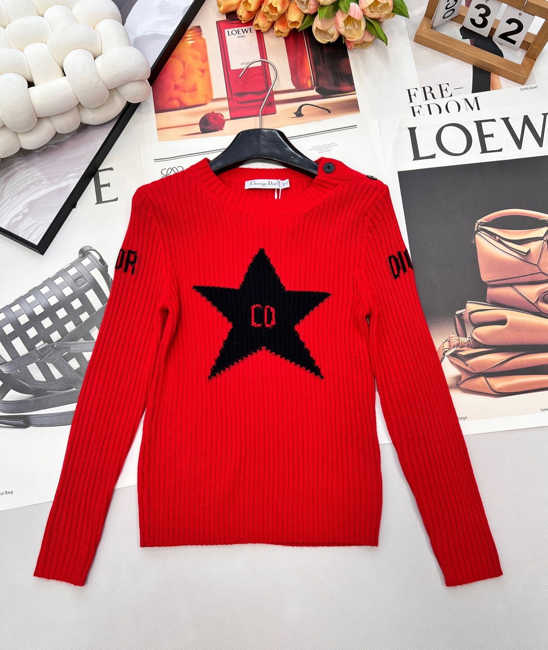 NO:666142,Dior's new five-pointed star crochet sweater is the most eye-catching style in autumn and winter - the visual focus is full of red background + black five-pointed star crochet, with the classic CD logo embedded in the middle, shoulder buttons + letter details on the sleeve sides, cool and retro, and instantly recognizable; - The texture is close-fitting and comfortable. The pitted knitted fabric is soft and sinewy, and can be worn close to the body without being tied. It can be worn alone or layered in autumn and winter to support the look; -  The style is highly adaptable. Pair it with jeans for a casual and cool style. Pair it with a leather skirt for a sweet and hot girl look. Even with suit pants, you can wear it with a lazy and high-end feel. Complete three standards, large quantities are shipped. Sizes sml, dior, skirts, jeans, business suit,  19860909Dior新款五角星钩花针织衫,是秋冬“吸睛王炸款” - 视觉焦点拉满正红底色+黑色五角星钩花,中间嵌着经典CD标识,肩扣+袖侧字母细节,又酷又复古,一眼就能穿出辨识度； - 质感贴身舒服坑条针织面料软而有筋骨,贴身穿不扎,秋冬单穿或内搭都能撑得起造型； - 风格适配度高搭牛仔裤是随性潮酷风,配皮裙是甜飒辣妹感,哪怕搭西装裤也能穿出慵懒高级感~三标齐全,大货出 尺码sml 编,,dior,skirts,jeans,business suit, ,Women's clothing