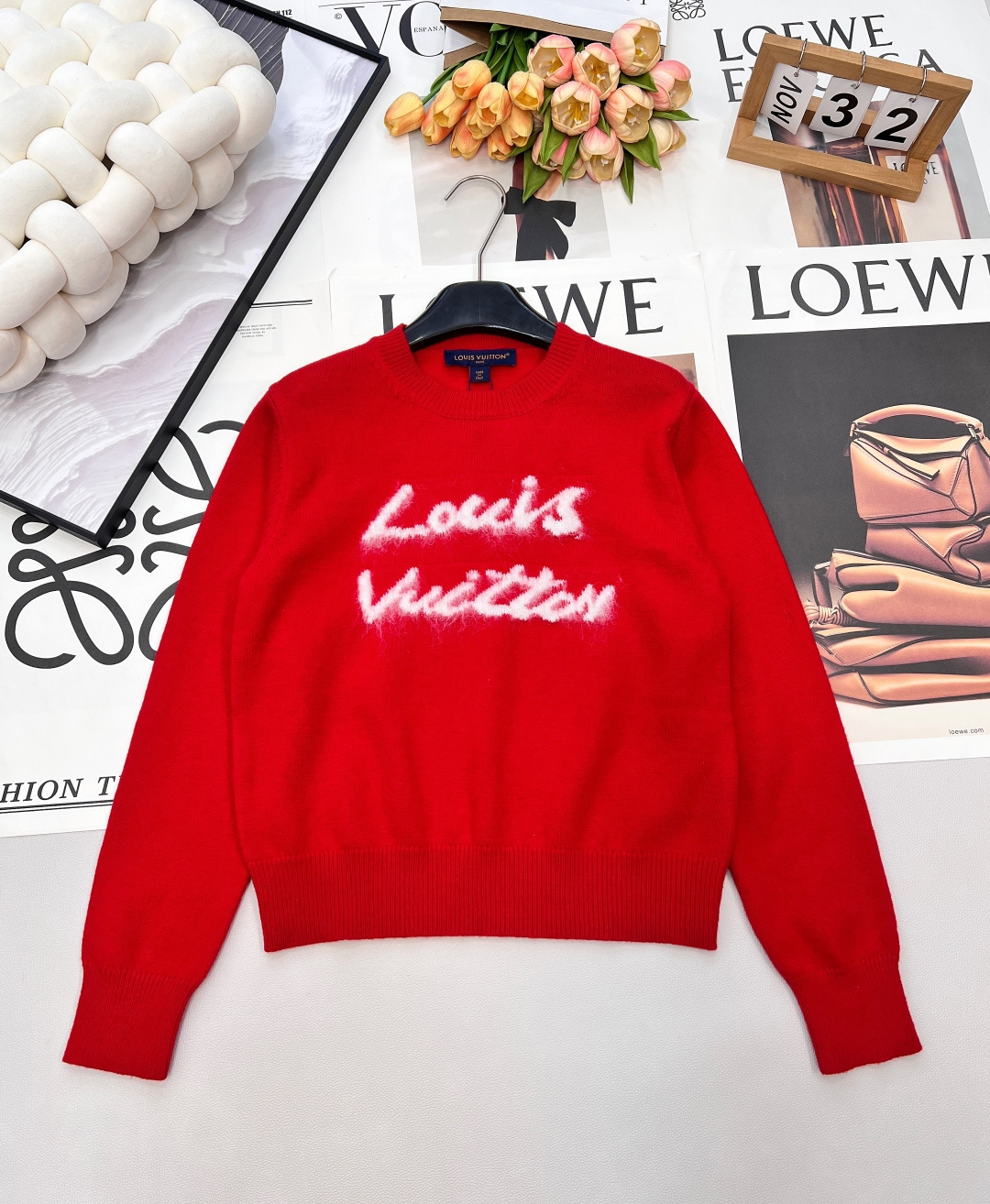 NO:694655,LOUIS VUITTON Chinese New Year limited edition mohair letter sweater sweater is red and very colorful, and the white graffiti letters on the chest are very design. Made of cashmere blended material, soft and warm, super comfortable to wear in autumn and winter! The short slim fit, paired with high-waisted pants and skirts, makes you taller and slimmer, full of festive atmosphere, and very fashionable for daily outings~ Wear it in the New Year and Christmas, it is festive and high-end, and it can easily become the focus of the audience!  Wearing alone as an inner layer can be the finishing touch in the look, combining the personality of luxury brands and the enthusiasm of winter into a unique tone and full of festive atmosphere. Whether it is paired with jeans or a skirt, it looks great and can easily create a New Year shirt or holiday outfit. Red symbolizes happiness and good luck. Wear it in the New Year and the year of your zodiac, which means prosperity and good luck! Three standards are complete, two colors are available. Size sml code,, louis  vuitton,skirts,jeans,sweaters,19860909LOUIS VUITTON 中国新年限定马海毛字母针织衫毛衣正红色超显气色,胸前白色涂鸦字母超有设计感. 羊绒混纺材质,柔软又保暖,秋冬穿超舒服! 短款修身版型,搭高腰裤裙显高显瘦,节日氛围感拉满,日常出街也很时髦～新年,圣诞穿它,喜庆又高级,轻松成为全场焦点! 单穿内搭都能成为造型里的点睛之笔,把奢牌的个性与冬日的热烈揉成独一份的腔调 节日氛围感拉满.无论配牛仔裤还是半裙都很出彩,轻松打造新年战袍或节日穿搭“.红色象征喜庆好运 新年、本命年穿它,寓意红红火火,好运连连！三标齐全,两色出 尺码sml 编码,,louis vuitton,skirts,jeans,sweaters,,Women's clothing