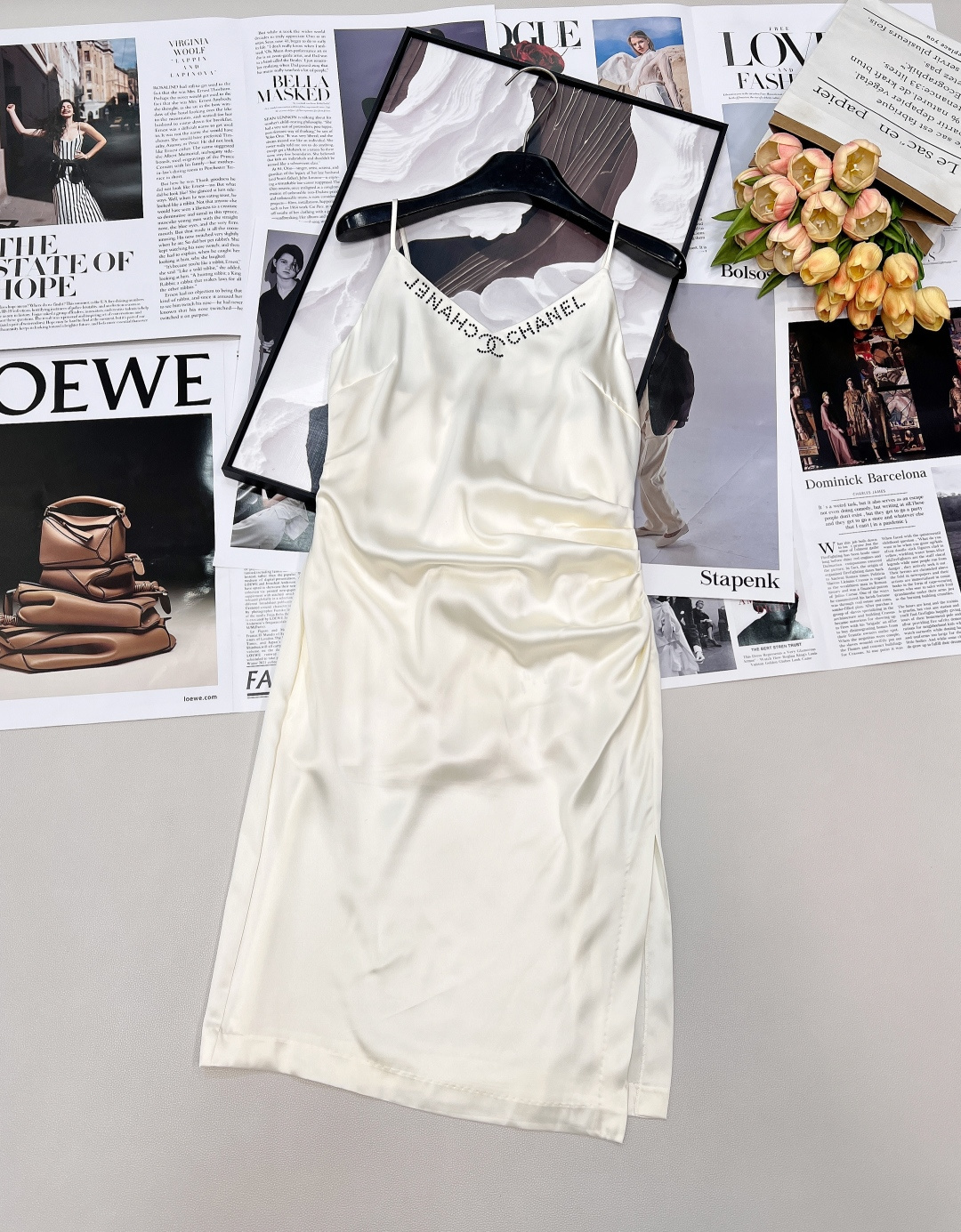 NO:739826,CHANEL's new 'little fragrant satin suspender skirt' - Wear a sense of luxury on your body. The apricot-colored satin has its own soft light filter, and the silky luster flows between the drapes, like the spring moonlight rubbing into the fabric. The hot diamond letters and double C logo on the V-neck shimmer in the light, anchoring the brand's genes in a low-key and precise manner. Every time you turn around, you will have an elegant aura.  The pleats on the side waist subtly modify the body shape, and the side slits inadvertently expose the leg lines, which makes the sexy just right. Whether worn alone to a candlelight dinner, or wearing a small fragrant jacket when going out, it can easily hold the ladylike atmosphere. It is the existence in the wardrobe that 'wears it once and is stunning every time'. Complete with three standards, great product!  Size sml code,,chanel,skirts,jackets & coats,19860909CHANEL新款小香风缎面吊带裙」—— 把高级感穿在身上, 奶杏色缎面自带柔光滤镜,垂坠间流转着丝滑光泽,像把春日的月光揉进衣料里.V领处的烫钻字母与双C标识,在光线下细碎闪烁,低调又精准地锚定了品牌基因,每一次转身都自带优雅气场. 侧腰褶皱巧妙修饰身形,侧边开叉不经意间露出腿部线条,把性感拿捏得恰到好处.无论是单穿赴一场烛光晚餐,还是外搭小香风外套出街,都能轻松hold住名媛氛围感,是衣橱里那件“穿一次惊艳一次”的存在.三标齐全,大货出！ 尺码sml 编码,,chanel,skirts,jackets & coats,,Women's clothing