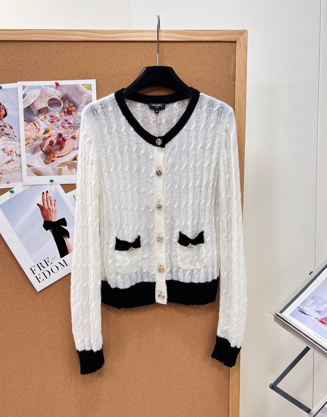 NO:955175,CHANEL's new hollow cable knitted cardigan with gold buttons is a timeless black and white color knitted jacket. The handmade hollow cable texture has a gentle and hazy feeling. The atmosphere of a rich family can be filled with one click, and it can be held for commuting and dating!  The soft mohair blended yarn is selected, which is light and transparent, delicate and waxy without scratching the skin. It has an airy hollow weave, which is perfect for transitional wear in spring, summer, air-conditioned rooms, and early autumn. It is light and not heavy. The classic round neck is black contrast edging, and the hem, cuffs, and pockets are all black contrast splicing. The contrast between black and white is simple and advanced; the placket has a custom-made embossed metal gold buckle, which has a noble luster and a texture that matches the original version at the counter.  The whole body is made of three-dimensional cable knitting, with exquisite three-dimensional texture. The symmetrical patch pockets on both sides are embellished with mini gold buckles, and the details are rich; the short-fitting version, neat waist tightening and high waistline, friendly to small people, and modifying the body proportions. It is elegant and delicate when worn alone, with suspenders and shirts as gentle and slimming; paired with skirts and straight pants, it has a light and luxurious temperament. A full set of the same accessories at the counter is high-end for gifts and personal use. Complete with three standards, large quantities of goods!  Size sml code,,chanel,skirts,jackets & coats,shirts,19860909CHANEL新款镂空绞花金扣针织开衫永不过时的小香黑白配色针织外套,手工镂空绞花纹理自带温柔朦胧感,富家千金氛围感一键拉满,通勤约会全hold住！ 甄选柔润马海毛混纺纱线,轻盈通透,细腻软糯不扎肤,自带空气感镂空织法,春夏空调房、早秋过渡穿刚刚好,轻薄不厚重. 经典圆领黑色撞色包边,下摆、袖口、口袋全部黑色撞色拼接,黑白对比简约高级；门襟定制浮雕金属金扣,光泽显贵,质感对标专柜原版. 全身立体绞花镂空编织,肌理精致立体,两侧对称贴袋搭配迷你小金扣点缀,细节层次丰富；合身短款版型,利落收腰拉高腰线,小个子友好,修饰身材比例. 单穿优雅精致,内搭吊带、衬衫温柔显瘦；搭配半裙、直筒裤都自带轻奢气质,全套专柜同款辅料,送礼自留都高级.三标齐全,大货出！ 尺码sml 编码,,chanel,skirts,jackets & coats,shirts,,Women's clothing