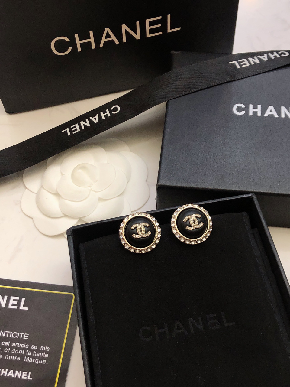 chanel black gold round cc stud earrings