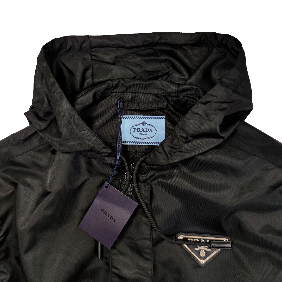 Top Prada hooded windbreaker with drawstring, large pockets, and waist-cinching design. Nylon fabric, slim fit. Sizes S, M, L.-Big cat