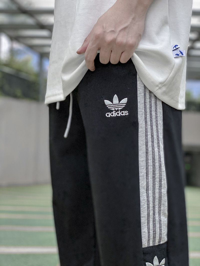 Adidas阿迪达斯三叶草拼接运动休闲卫裤情侣款长裤