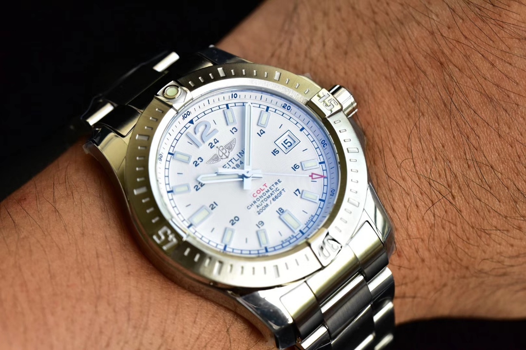 Wearing a replica Breitling 43mm watch